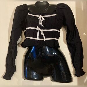 Flirty Black Long Sleeve Top with White Bow Accents
